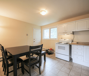 Fredericton apartment for rent - A kitchen with a table and chairs.