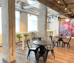 Edmonton apartment for rent - A modern dining area with a large mural on the wall.