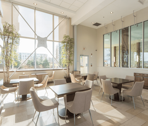 Kanata Ottawa apartment for rent - A modern dining room with large windows and a view of the city.