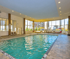 Kanata-Ottawa apartment for rent - A large indoor swimming pool with a "No Diving" sign.