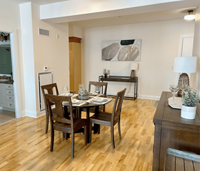 Kanata-Ottawa apartment for rent - A dining room with a wooden table and chairs.