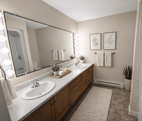 Fredericton apartment for rent - A bathroom with two sinks and a large mirror.