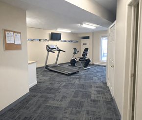 Fredericton apartment for rent - A gym room with a treadmill and a stationary bike.