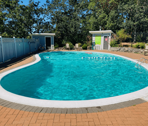 Victoria apartment for rent - A small pool with a white border and a white building in the background.