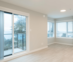 Courtenay apartment for rent - A room with a sliding glass door and a window with blinds.