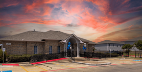 Port Arthur apartment for rent - a house with a red and orange sky in the background