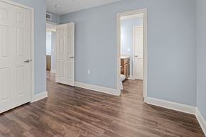 Beaumont apartment for rent - a renovated living room with blue walls and wood floors