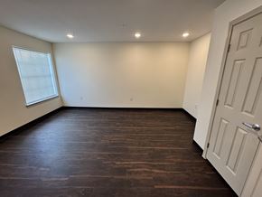 Port Arthur apartment for rent - A room with a white door and a window with blinds.