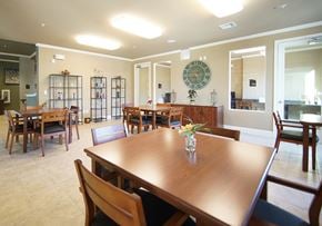 Tomball apartment for rent - A dining room with a wooden table and chairs.