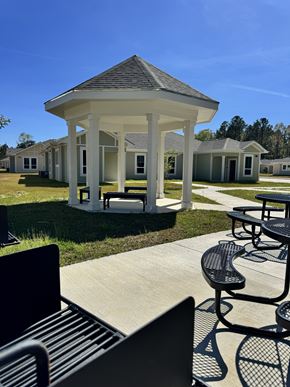 Lumberton apartment for rent - A gazebo is surrounded by benches in a park.