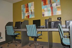 Fort Worth apartment for rent - A room with yellow walls and a painting on the wall.