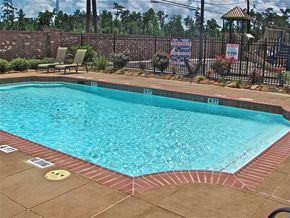 Vidor apartment for rent - a swimming pool with a fence around it