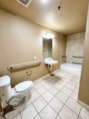 Freeport apartment for rent - A white toilet sits in a bathroom with a white sink and a white tub.
