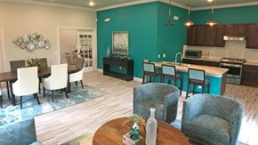 Orange apartment for rent - A dining room with a table set for two.