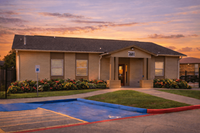 Port Arthur apartment for rent - A building with the number 7601 on it is surrounded by a parking lot.