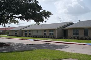 Bay City apartment for rent - a group of houses on the side of a street