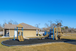 Orange apartment for rent - our playground is in front of a yellow house
