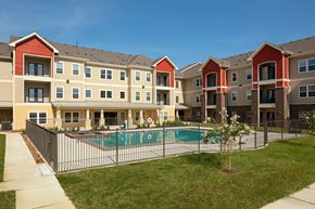 Beaumont apartment for rent - an apartment building with a pool in front of it