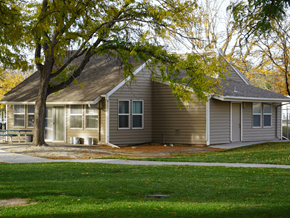 Grand Junction apartment for rent - A house with a tree in front of it at Grand Manor Apartments, Grand Junction, CO, 81501.