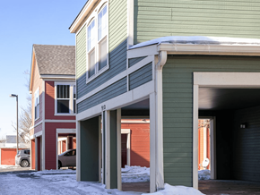 Greeley apartment for rent - A green house with a red car parked in front at Meeker Commons Apartments, Colorado, 80631