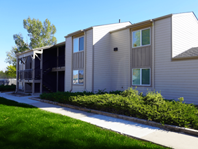 Fort Morgan apartment for rent - A building with a grey siding and a white roof at Gateway Village Apartments, Fort Morgan, CO 80701