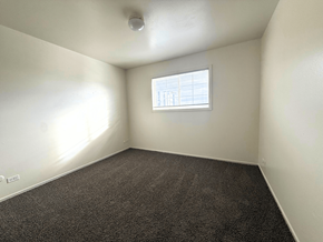 Denver apartment for rent - A room with a window and carpeted floor at Townview Plaza Apartments, Denver, CO.
