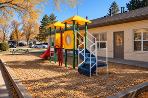 Westminster apartment for rent - A playground with a yellow and green structure and a blue slide.