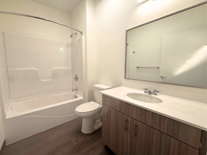Fort Morgan apartment for rent - A white bathroom with a toilet, sink, and bathtub.