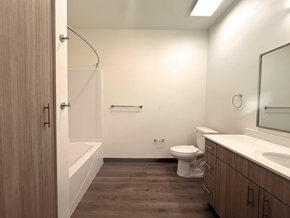 Fort Morgan apartment for rent - A bathroom with a toilet, sink, and bathtub.