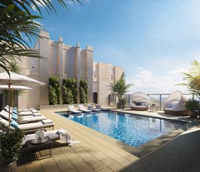 Bethesda apartment for rent - A modern pool area with lounge chairs and umbrellas.