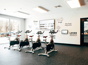 Norwalk apartment for rent - A gym with exercise bikes and inspirational quotes on the wall.