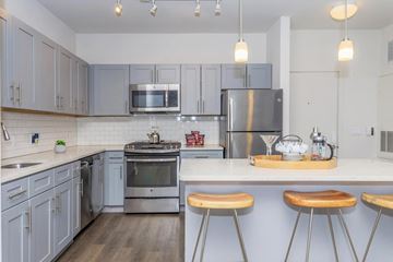 Norwalk apartment for rent - A kitchen with a stove top oven and a refrigerator.