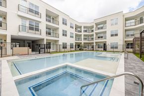 Sante Fe apartment for rent - A swimming pool in front of apartment buildings.