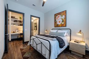 Austin apartment for rent - a bedroom with a bed and a door to a bathroom