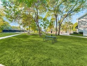 Austin apartment for rent - A park with a bench and trees.