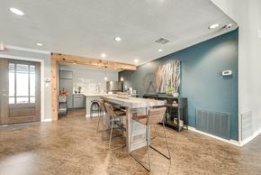 Dallas apartment for rent - A kitchen with a dining table and chairs.