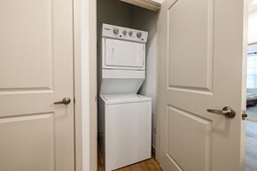 Sante Fe apartment for rent - A white dishwasher and oven are built into a wall in a kitchen.