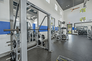Austin apartment for rent - A gym with a weightlifting area.