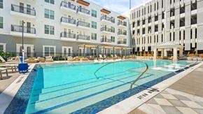 Frisco apartment for rent - a large swimming pool in front of an apartment building
