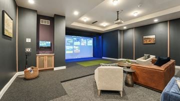 Frisco apartment for rent - a living room with a projector screen and a couch