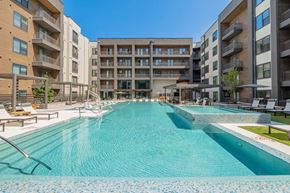 Austin apartment for rent - A large indoor swimming pool in a residential building.