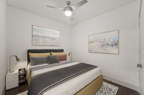 Frisco apartment for rent - a bedroom with a bed and a ceiling fan