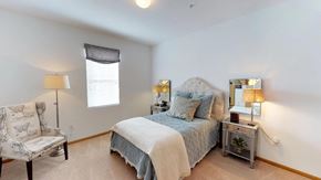 Grove City apartment for rent - Bedroom with cozy bed at Brookfield Village Apartments, Ohio