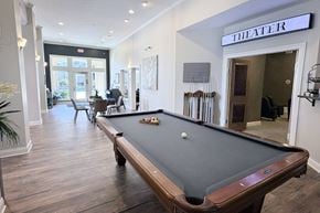 Columbus apartment for rent - A pool table in a room with a sign that says "THEATER".