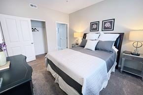 Columbus apartment for rent - A bedroom with a large bed and two nightstands.