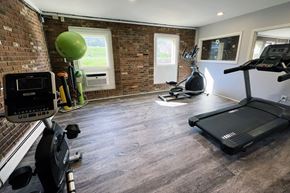 Covington apartment for rent - a gym with a brick wall and a treadmill and exercise equipment at Crown Pointe Apartments, Kentucky