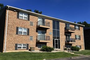 Amelia apartment for rent - A brick building with balconies and the number 1760 on the door.