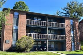 Cold Spring apartment for rent - A large brick building with a balcony in the middle.