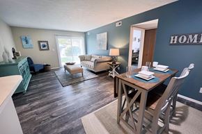 Loveland apartment for rent - A dining room with a wooden table and chairs.
