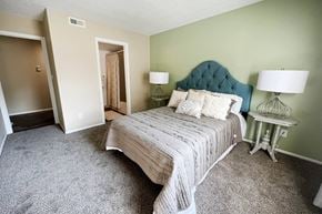 Loveland apartment for rent - a bedroom with a bed and two lamps  at Steeplechase Apartments, Loveland, 45140